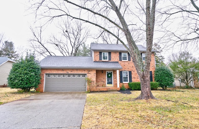 view of front facade with a front yard and a garage