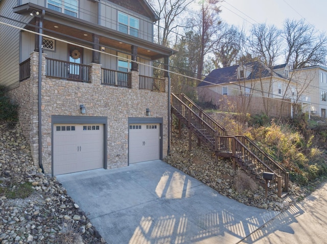 view of front of house with a garage and a balcony