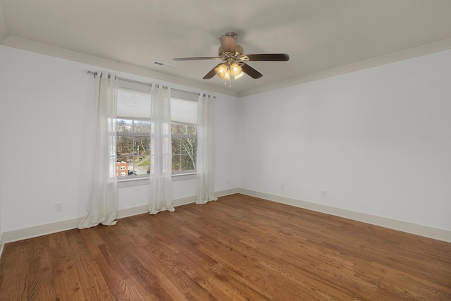 empty room featuring ceiling fan and hardwood / wood-style floors