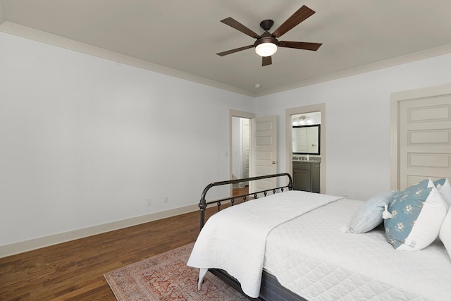 bedroom featuring connected bathroom, ceiling fan, and dark wood-type flooring