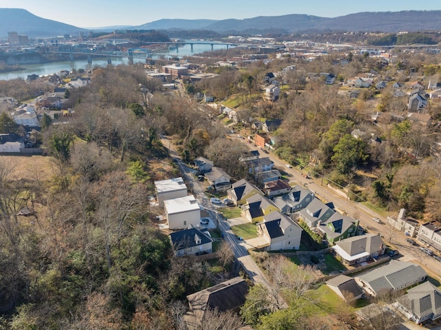 drone / aerial view featuring a water and mountain view