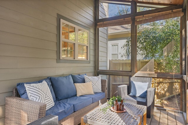 sunroom featuring vaulted ceiling