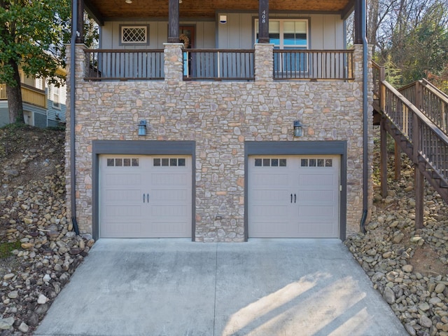 view of front of property with a garage and a balcony