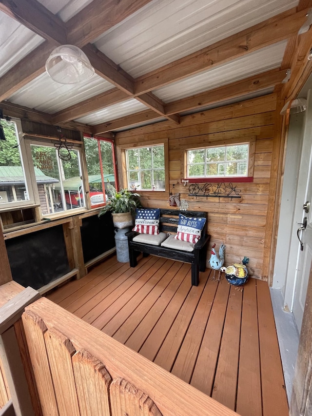 sunroom with beamed ceiling