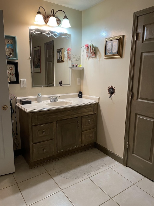 bathroom featuring baseboards, vanity, and tile patterned floors