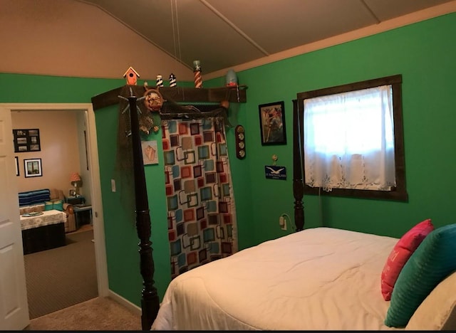 bedroom with lofted ceiling and carpet flooring