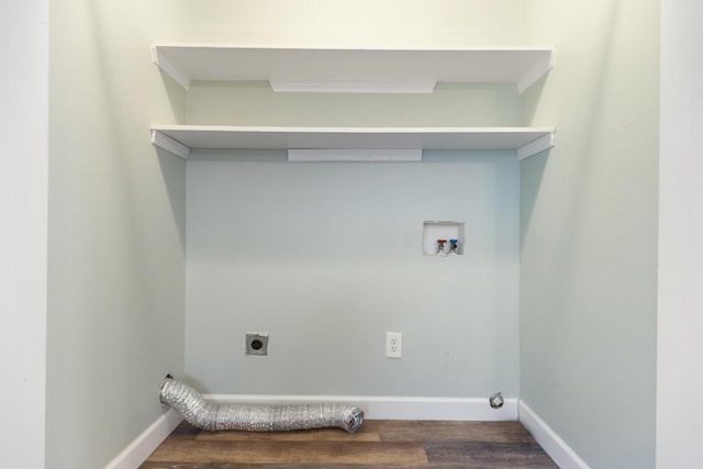 clothes washing area with hookup for a washing machine, dark wood-type flooring, crown molding, and electric dryer hookup