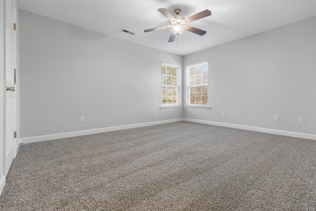 empty room with ceiling fan and carpet floors