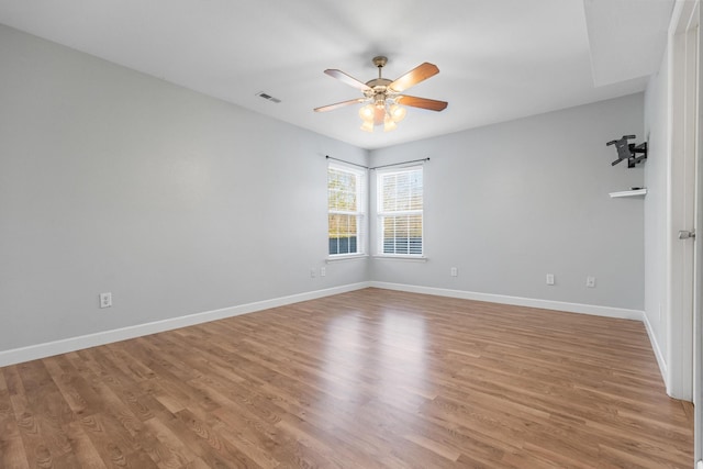 empty room featuring ceiling fan and light wood-type flooring