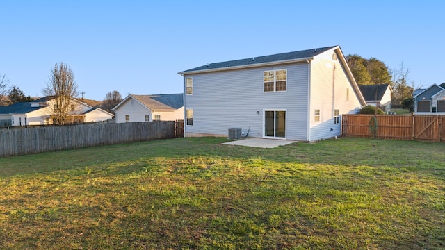 back of property featuring central air condition unit, a patio area, and a lawn