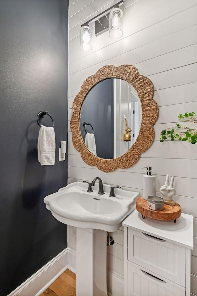 bathroom with hardwood / wood-style flooring