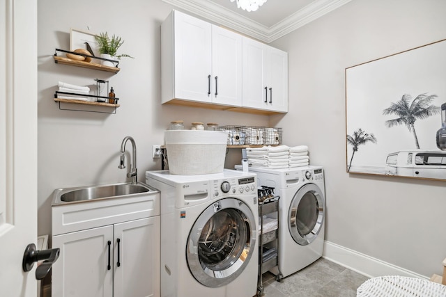 laundry area with sink, cabinets, separate washer and dryer, crown molding, and light tile patterned floors