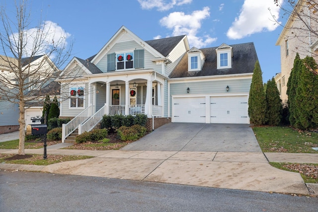 view of front of house featuring covered porch and a garage