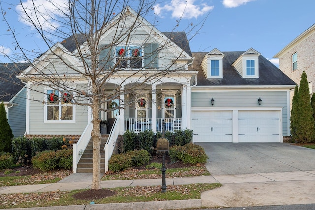 view of front facade with a porch and a garage