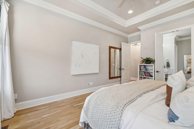 bedroom featuring light wood-type flooring, ceiling fan, and ornamental molding