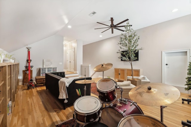 interior space with ceiling fan, light hardwood / wood-style floors, and lofted ceiling