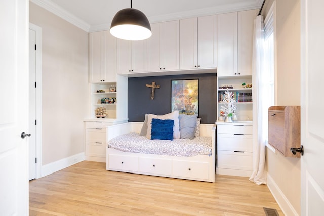 mudroom featuring crown molding and light wood-type flooring