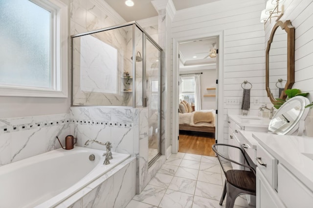 bathroom with vanity, separate shower and tub, ceiling fan, and crown molding