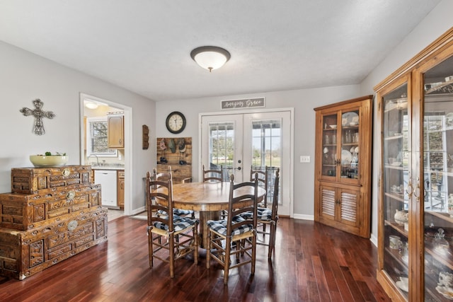 dining area featuring dark hardwood / wood-style flooring and french doors