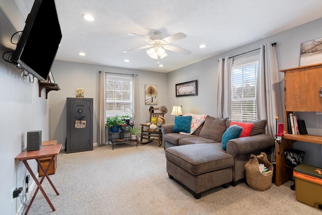 living room with light carpet and ceiling fan