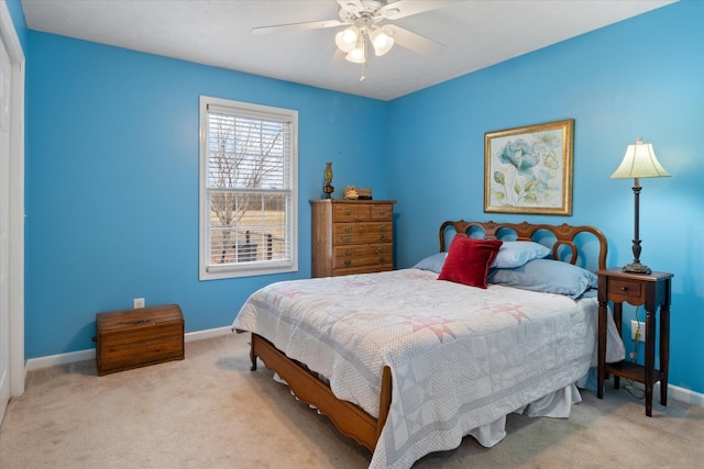 bedroom featuring light carpet and ceiling fan