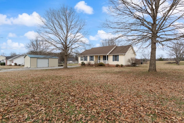 ranch-style home featuring a garage, a porch, and an outbuilding