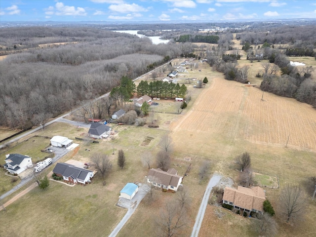 birds eye view of property with a rural view