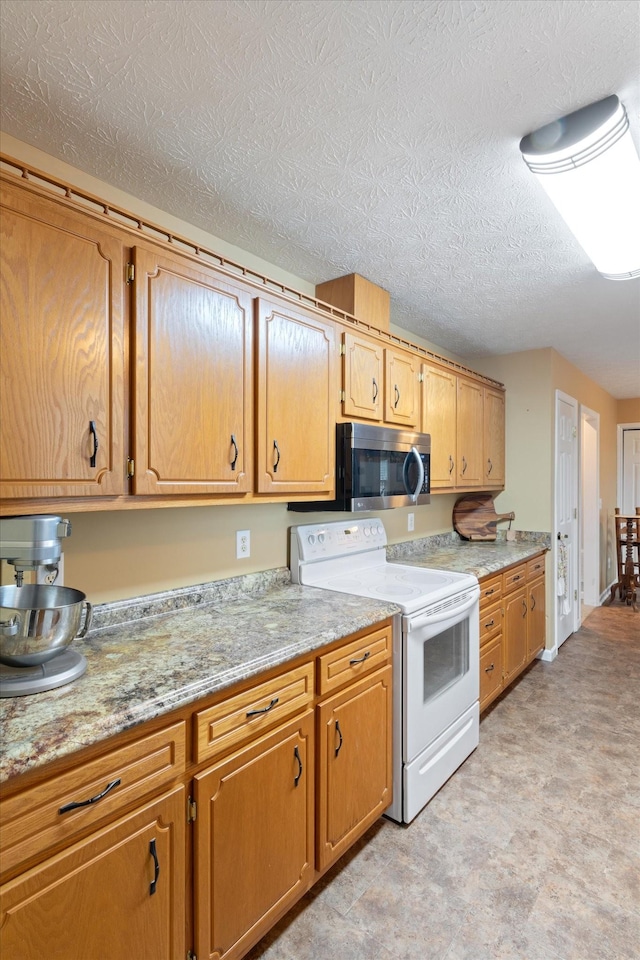 kitchen featuring white electric range, a textured ceiling, and light stone counters