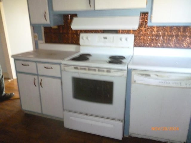 kitchen featuring white appliances and extractor fan