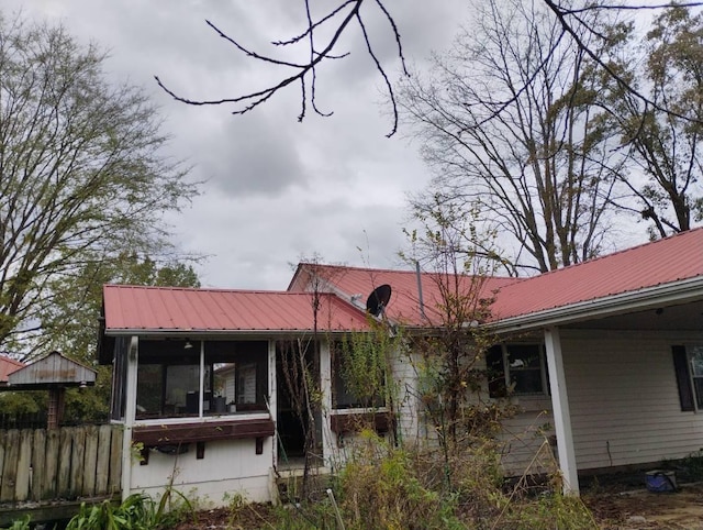 back of property featuring a sunroom