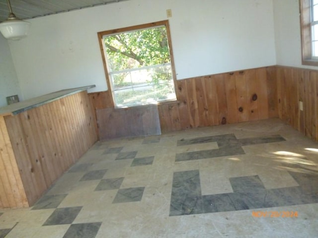 empty room with wooden walls