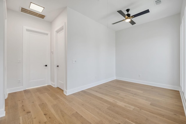 spare room featuring ceiling fan and light hardwood / wood-style floors