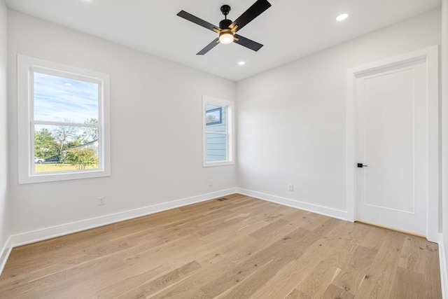 empty room featuring ceiling fan and light hardwood / wood-style floors