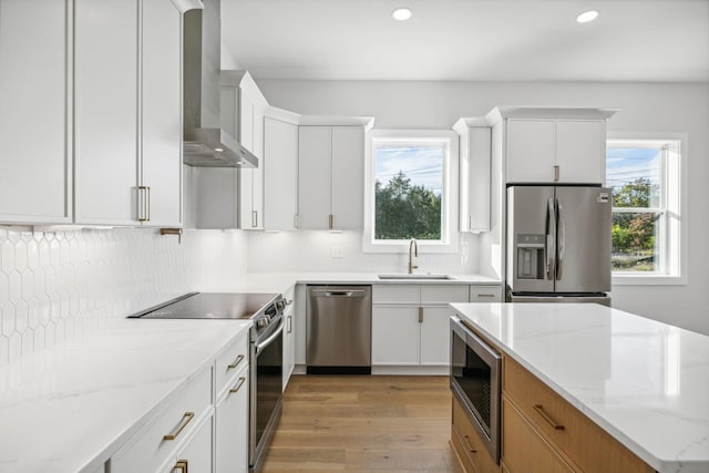 kitchen featuring white cabinets, sink, and appliances with stainless steel finishes