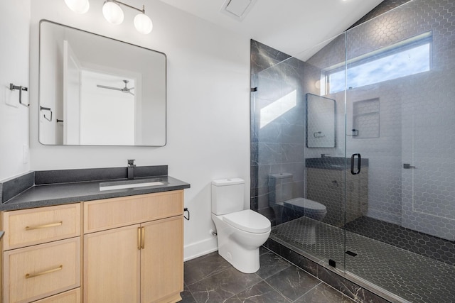 bathroom with ceiling fan, vaulted ceiling, an enclosed shower, toilet, and vanity