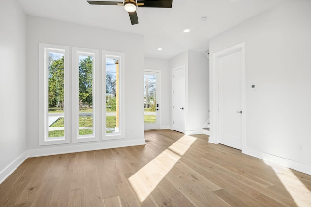 unfurnished room with light hardwood / wood-style floors and ceiling fan