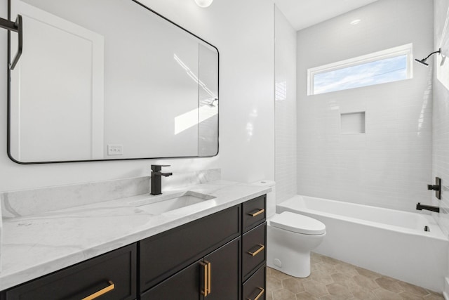 full bathroom with tile patterned floors, vanity, toilet, and tiled shower / bath