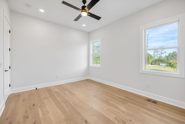 spare room with ceiling fan and light hardwood / wood-style floors