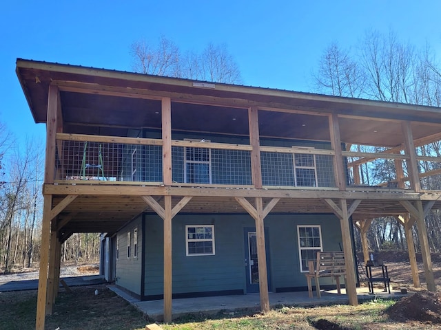 back of house with a patio