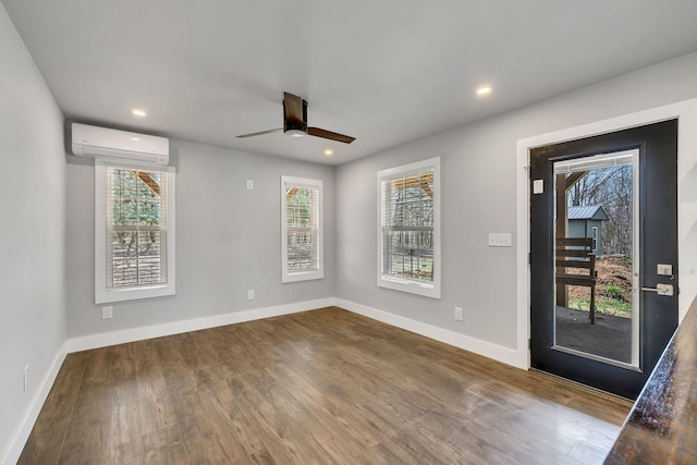 235 Union Ridge Rd, Wartrace, TN 37183 - empty room featuring a wall unit AC, baseboards, ceiling fan, and wood finished floors