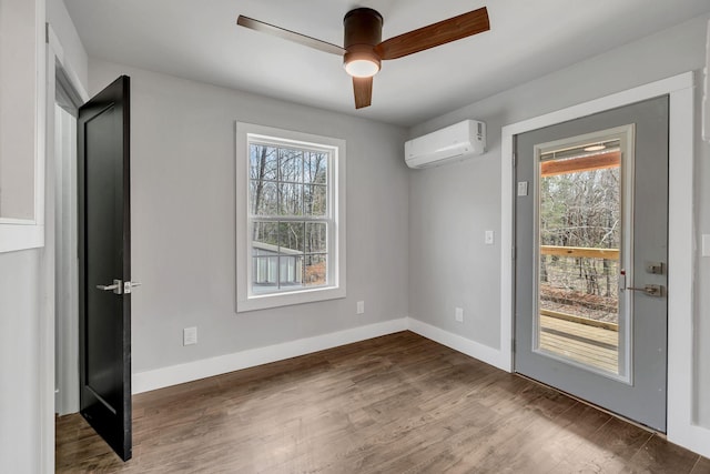 235 Union Ridge Rd, Wartrace, TN 37183 - empty room with a ceiling fan, baseboards, a wall mounted air conditioner, and wood finished floors