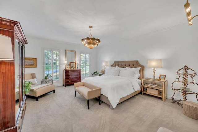 bedroom featuring light colored carpet and a notable chandelier