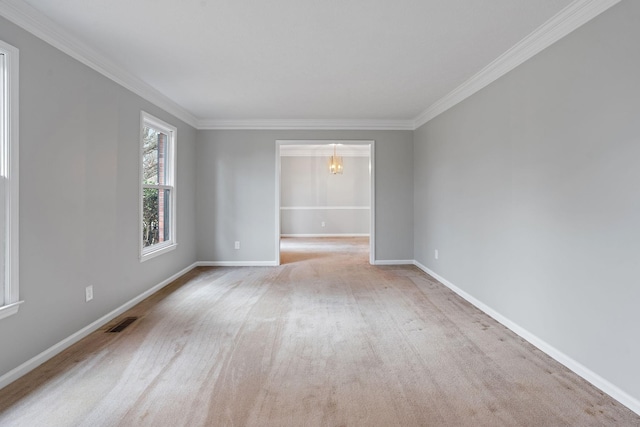 carpeted empty room with crown molding and a notable chandelier