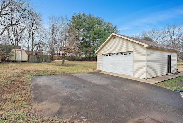 garage featuring a yard