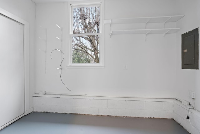 interior space featuring electric panel and concrete floors