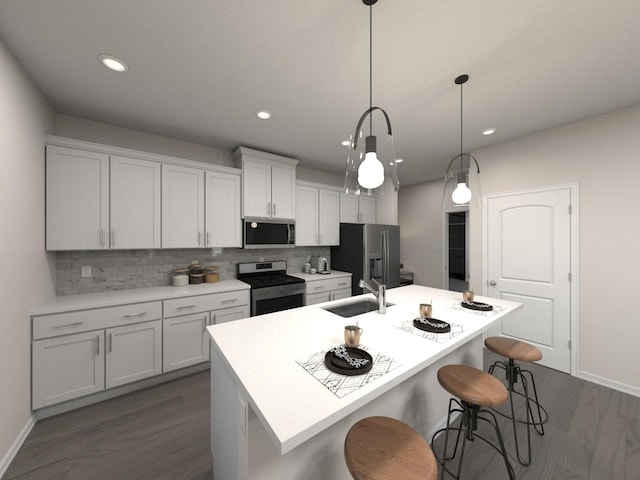 kitchen with a center island with sink, sink, decorative light fixtures, white cabinetry, and stainless steel appliances