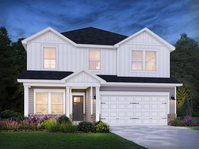 view of front of property with a garage and a front yard