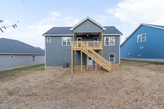 back of property with central air condition unit, ceiling fan, and a deck