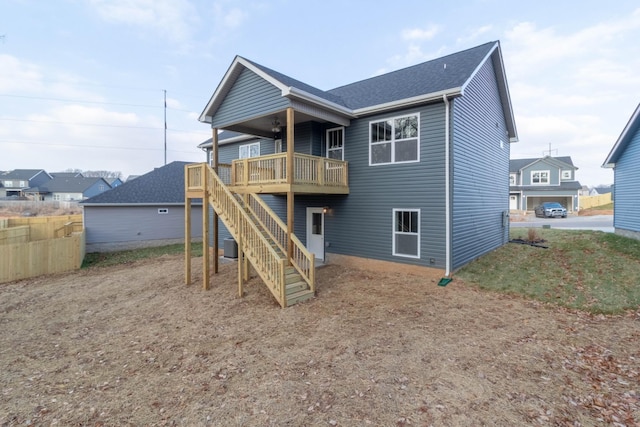 rear view of house with a wooden deck