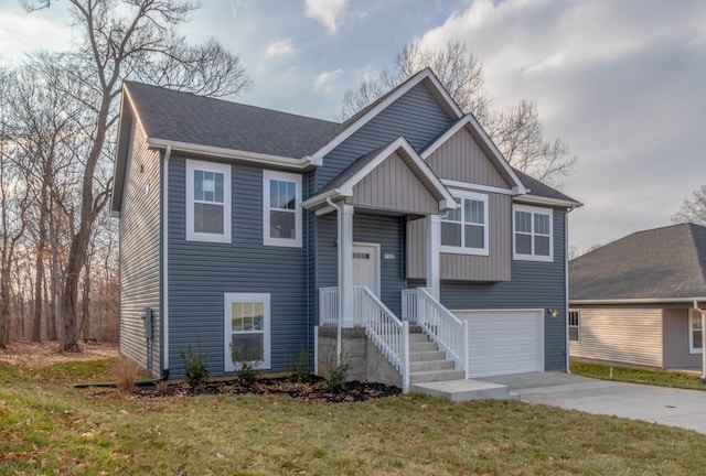 view of front of home featuring a garage and a front lawn